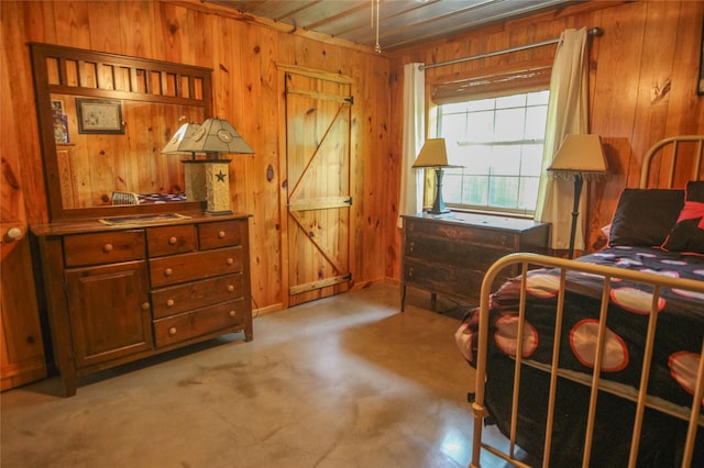 14615 County Road 2337, Tyler, TX 75707 - bedroom with wooden walls and concrete flooring