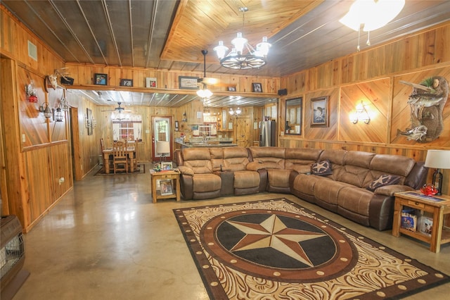 14615 County Road 2337, Tyler, TX 75707 - living area featuring concrete floors, wooden walls, wood ceiling, an inviting chandelier, and visible vents