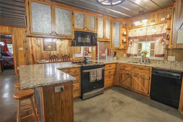 14615 County Road 2337, Tyler, TX 75707 - kitchen featuring black appliances, concrete flooring, a peninsula, and a sink