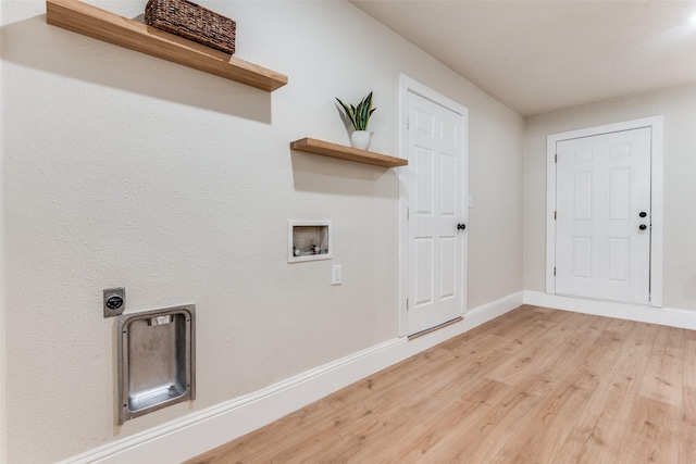 laundry area featuring hookup for an electric dryer, baseboards, washer hookup, wood finished floors, and laundry area