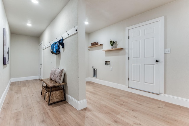 interior space featuring recessed lighting, light wood-style floors, and baseboards