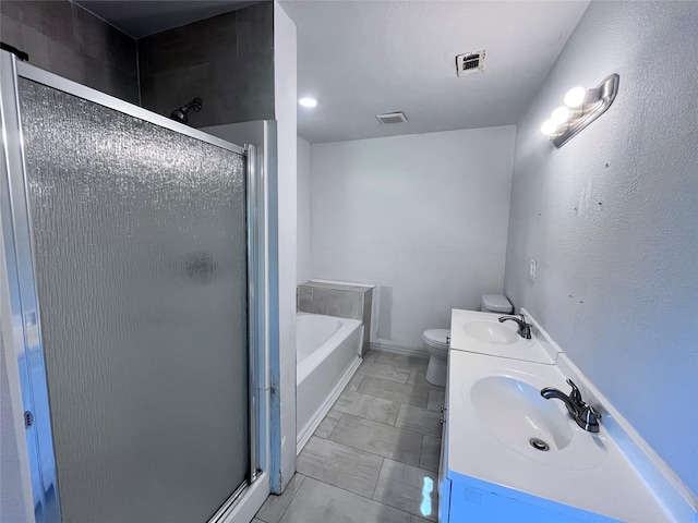715 Elm St, Mckinney, TX 75069 - bathroom with a stall shower, a bath, double vanity, and toilet