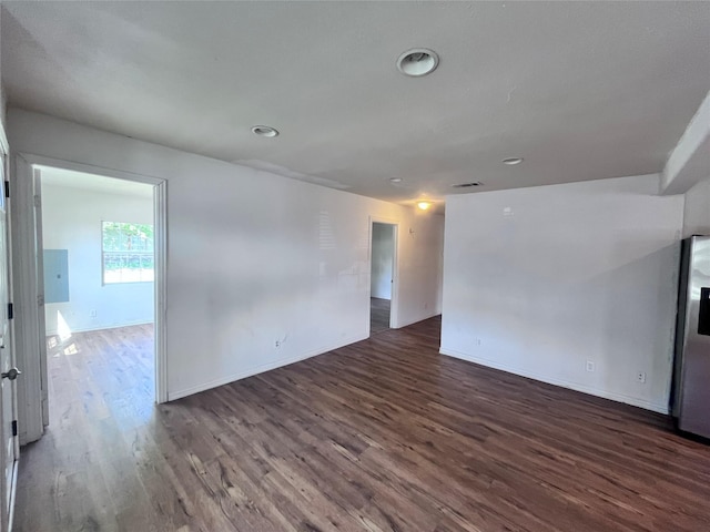 715 Elm St, Mckinney, TX 75069 - spare room featuring wood finished floors, baseboards, and recessed lighting