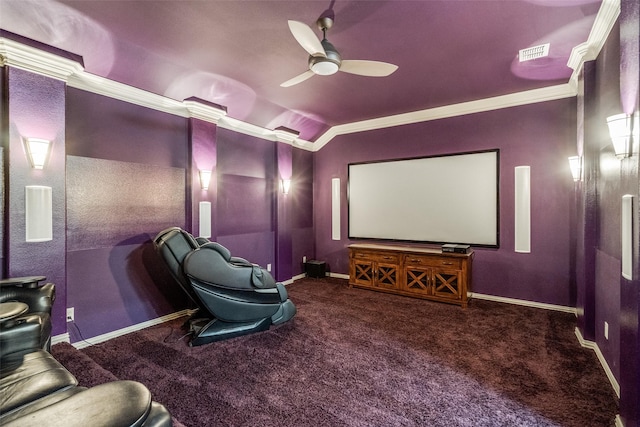 carpeted cinema featuring baseboards, visible vents, lofted ceiling, a ceiling fan, and crown molding