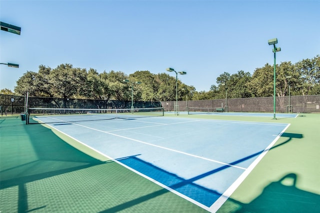 surrounding community featuring volleyball court, fence, and a yard