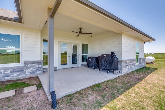 view of patio / terrace with grilling area, ceiling fan, and french doors