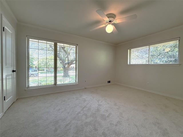11147 Carissa Dr, Dallas, TX 75218 - unfurnished room with a healthy amount of sunlight, crown molding, baseboards, and light carpet