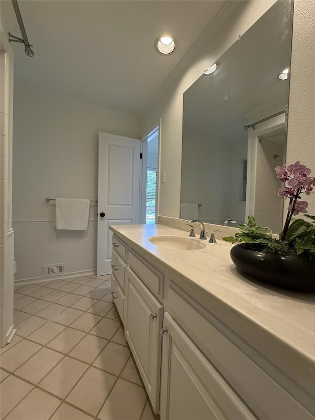 11147 Carissa Dr, Dallas, TX 75218 - bathroom featuring tile patterned floors, a sink, double vanity, visible vents, and recessed lighting