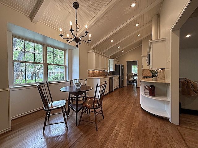11147 Carissa Dr, Dallas, TX 75218 - dining area featuring an inviting chandelier, beam ceiling, recessed lighting, and dark wood finished floors