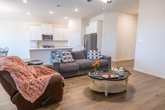 2712 Cain Dr, Anna, TX 75409 - living room featuring light wood-type flooring, baseboards, visible vents, recessed lighting, and a ceiling fan