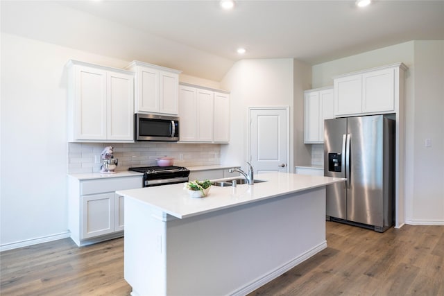 2712 Cain Dr, Anna, TX 75409 - kitchen featuring decorative backsplash, appliances with stainless steel finishes, wood finished floors, and a sink