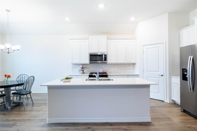 2712 Cain Dr, Anna, TX 75409 - kitchen with stainless steel appliances, light countertops, a sink, and a chandelier