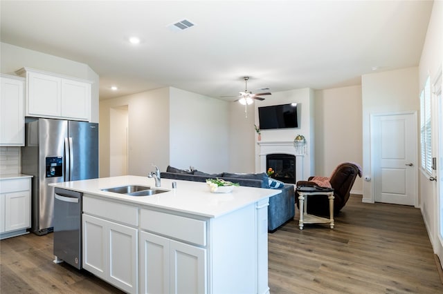 2712 Cain Dr, Anna, TX 75409 - kitchen featuring wood finished floors, visible vents, a ceiling fan, a sink, and appliances with stainless steel finishes
