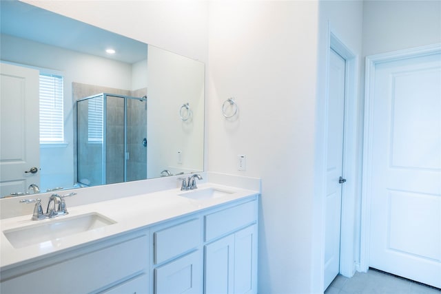 2712 Cain Dr, Anna, TX 75409 - bathroom with tile patterned flooring, a sink, double vanity, and a stall shower