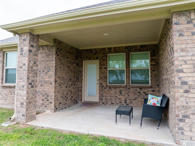 2712 Cain Dr, Anna, TX 75409 - doorway to property featuring a patio area and brick siding