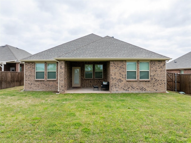2712 Cain Dr, Anna, TX 75409 - back of property with a patio area, a fenced backyard, brick siding, and a yard