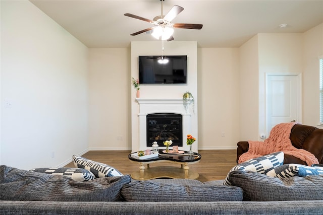 2712 Cain Dr, Anna, TX 75409 - living room featuring a glass covered fireplace, wood finished floors, baseboards, and ceiling fan