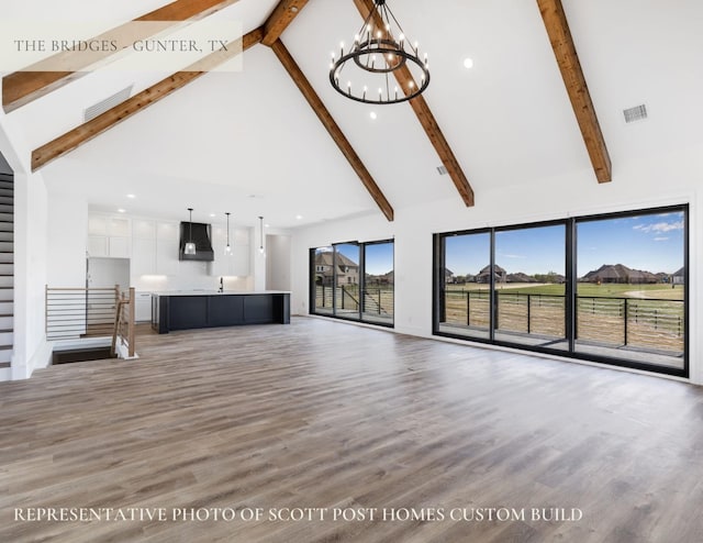 TBDLOT2 Jolene Ct, Van Alstyne, TX 75495 - unfurnished living room featuring high vaulted ceiling, a notable chandelier, beam ceiling, and visible vents