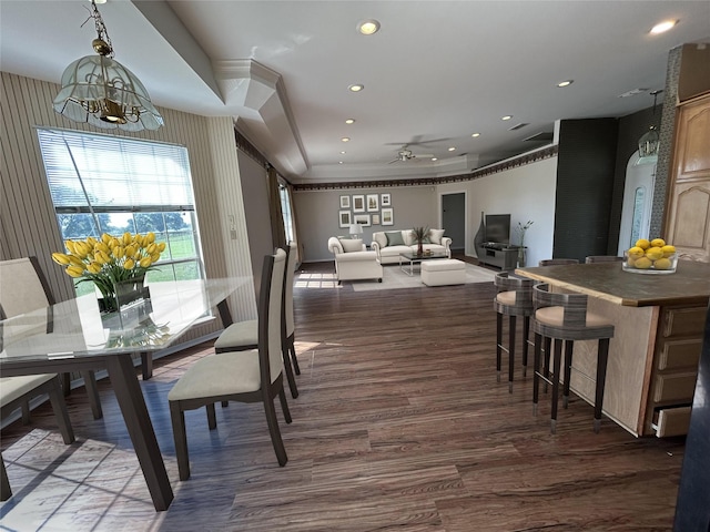 dining space featuring ceiling fan with notable chandelier, wood finished floors, recessed lighting, and crown molding