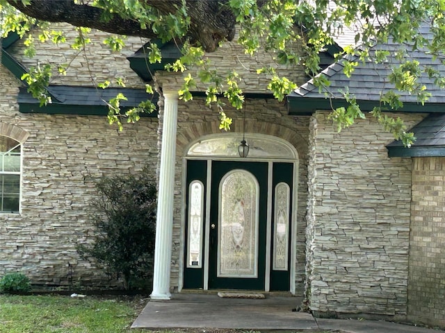 view of exterior entry with stone siding