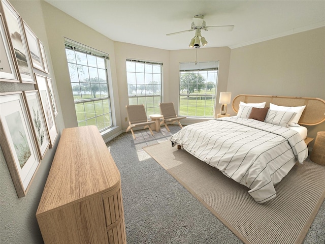 bedroom featuring a ceiling fan and light carpet