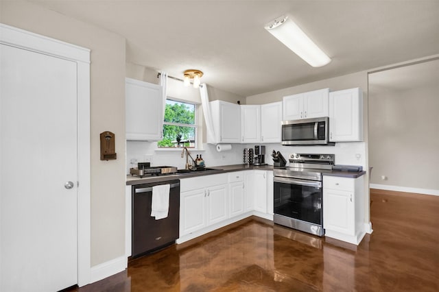 500 Nathan St, Saginaw, TX 76179 - kitchen with appliances with stainless steel finishes, a sink, dark countertops, baseboards, and white cabinetry