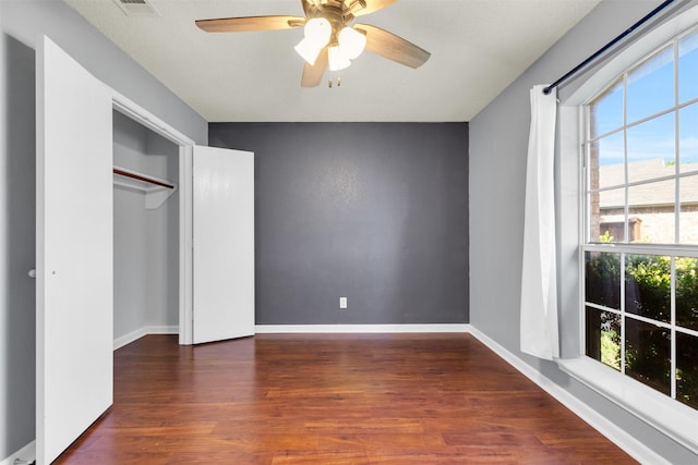 500 Nathan St, Saginaw, TX 76179 - unfurnished bedroom featuring wood finished floors, baseboards, and ceiling fan