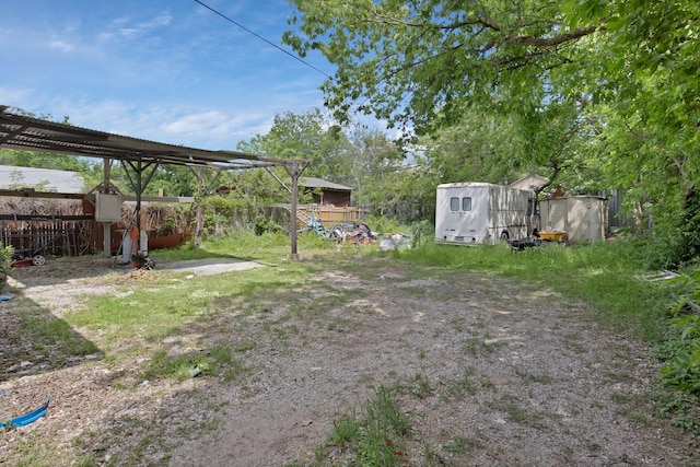 3431 Ada Ave, Fort Worth, TX 76105 - view of yard with fence, an outdoor structure, and a shed