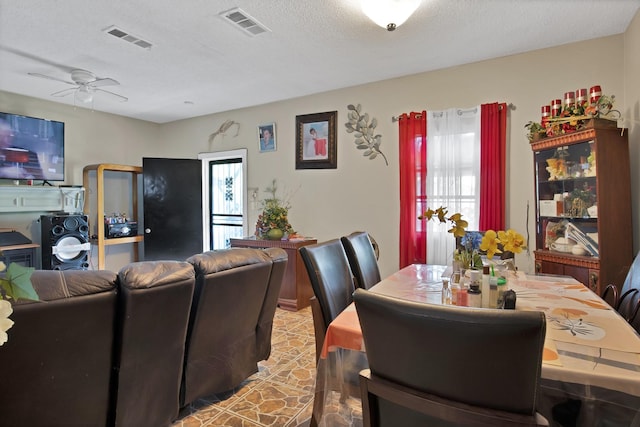 3431 Ada Ave, Fort Worth, TX 76105 - dining room with visible vents, a textured ceiling, and ceiling fan