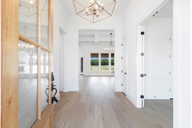 TBDLOT4 Durning Rd, Van Alstyne, TX 75495 - entrance foyer featuring beamed ceiling, light wood-style flooring, baseboards, and a notable chandelier