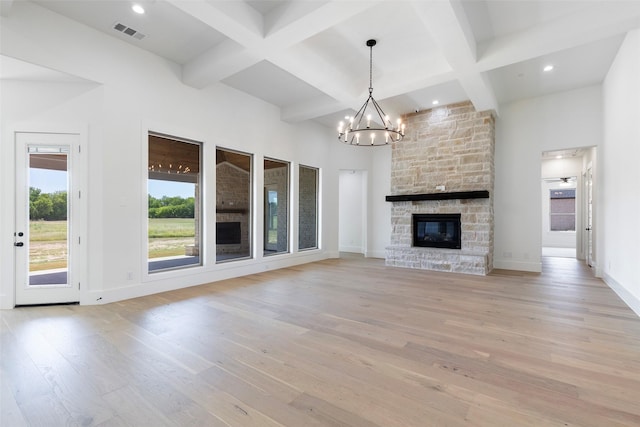 TBDLOT4 Durning Rd, Van Alstyne, TX 75495 - unfurnished living room featuring light wood-style floors, an inviting chandelier, beamed ceiling, baseboards, and visible vents