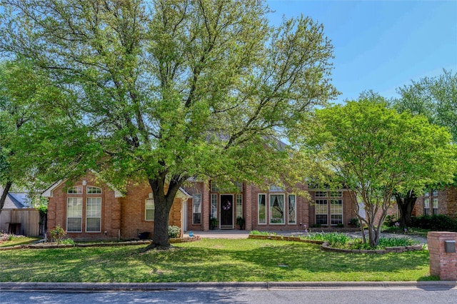 2101 Bois D Arc Dr, Sherman, TX 75092 - view of property hidden behind natural elements featuring brick siding