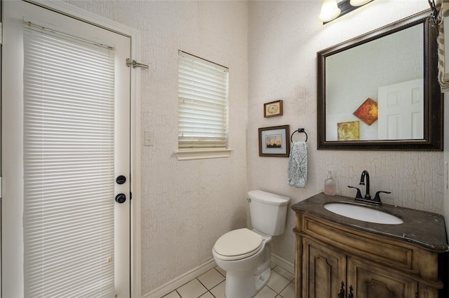 2101 Bois D Arc Dr, Sherman, TX 75092 - half bathroom featuring toilet, vanity, tile patterned floors, and baseboards