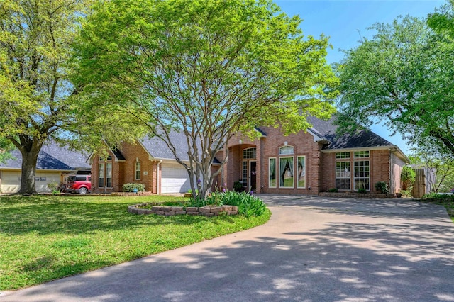 2101 Bois D Arc Dr, Sherman, TX 75092 - traditional-style home with brick siding, concrete driveway, a front yard, and roof with shingles