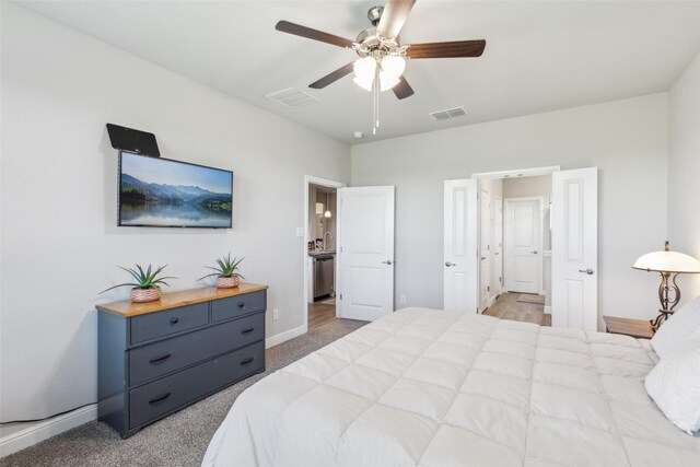 bedroom featuring ceiling fan, baseboards, visible vents, and carpet