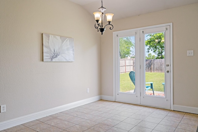 doorway with vaulted ceiling, baseboards, a notable chandelier, and light tile patterned floors