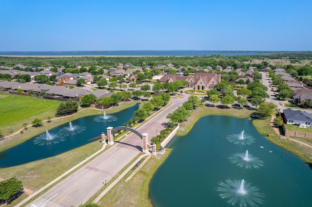 drone / aerial view with a residential view and a water view