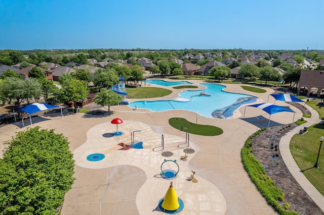 view of swimming pool with a residential view