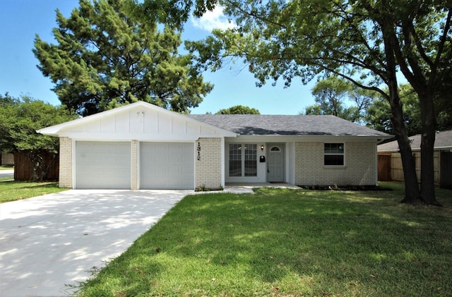 single story home with brick siding, an attached garage, driveway, and a front yard