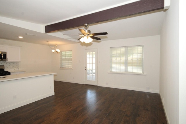 kitchen featuring dark wood-style flooring, tasteful backsplash, beamed ceiling, light countertops, and appliances with stainless steel finishes