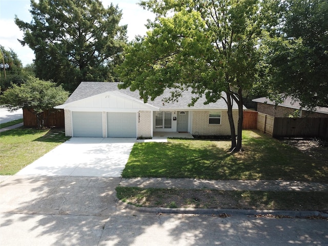ranch-style home featuring fence, driveway, a front lawn, and a garage