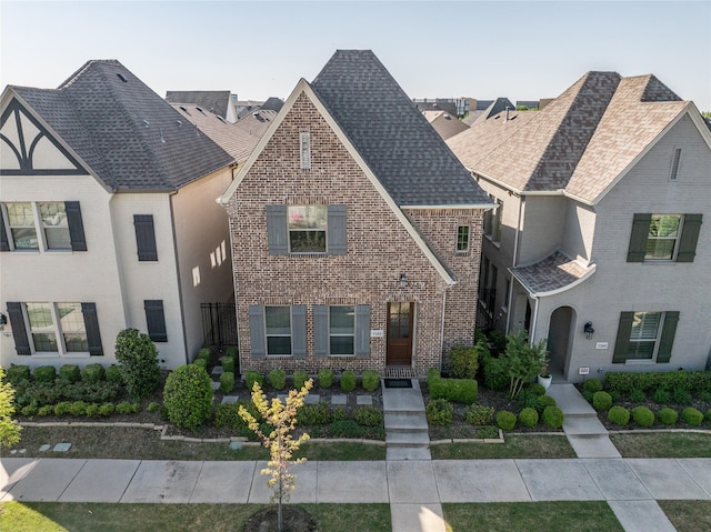 7305 Caladium Dr, Mckinney, TX 75070 - view of front of home featuring brick siding and a shingled roof