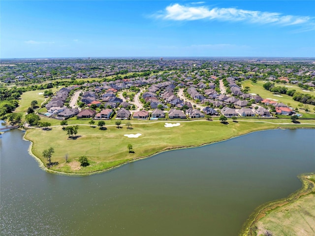 drone / aerial view featuring a residential view, a water view, and view of golf course
