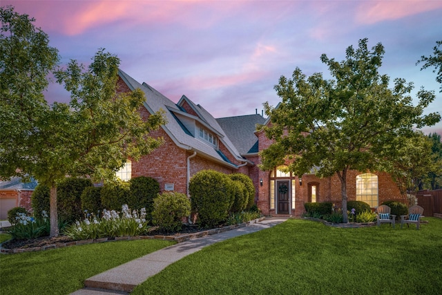 1809 Cotton Mill Dr, Mckinney, TX 75072 - view of front of house featuring a shingled roof, brick siding, and a front yard
