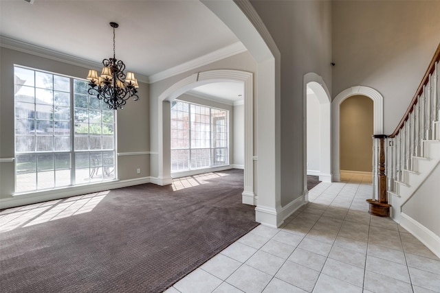 1809 Cotton Mill Dr, Mckinney, TX 75072 - unfurnished dining area featuring light colored carpet, arched walkways, ornamental molding, and plenty of natural light