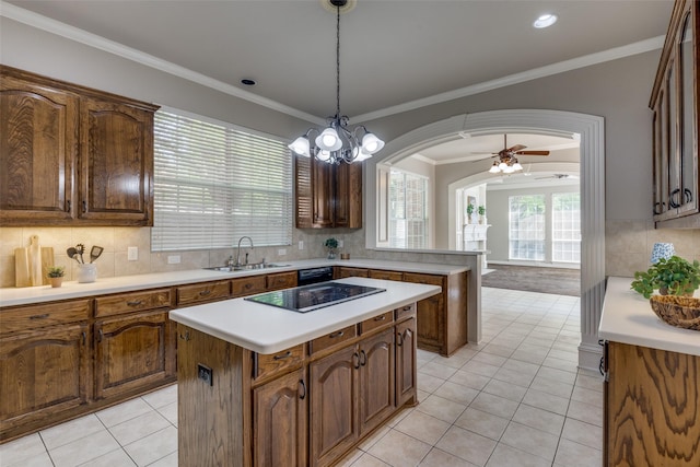 1809 Cotton Mill Dr, Mckinney, TX 75072 - kitchen with light tile patterned floors, arched walkways, a sink, a kitchen island, and black electric stovetop