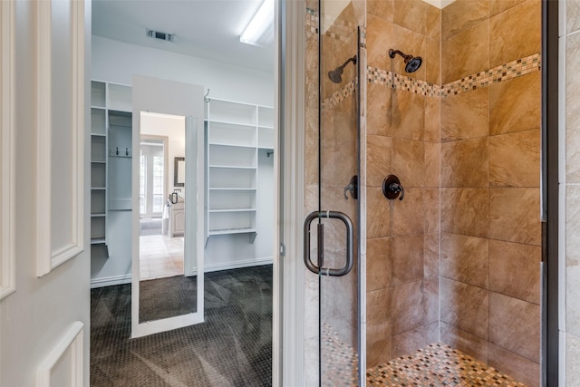 1809 Cotton Mill Dr, Mckinney, TX 75072 - bathroom with visible vents, a shower stall, and a walk in closet