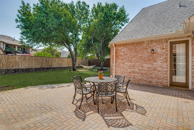 1809 Cotton Mill Dr, Mckinney, TX 75072 - view of patio with outdoor dining space and a fenced backyard