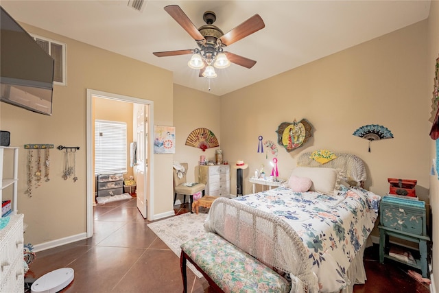 bedroom with ceiling fan, baseboards, tile patterned floors, and visible vents