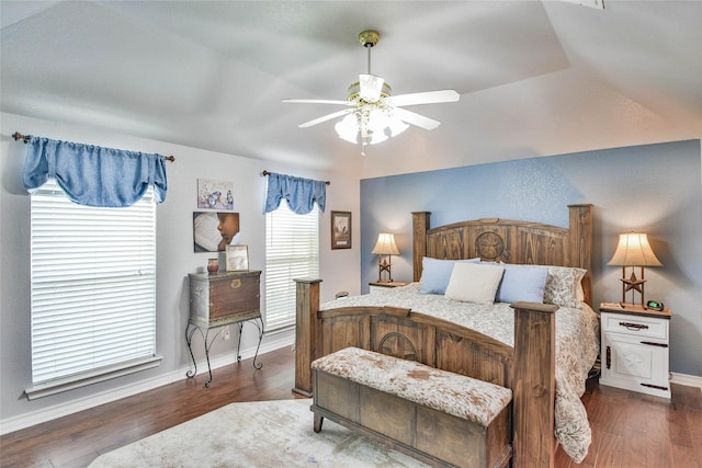 bedroom featuring baseboards, a ceiling fan, and wood finished floors